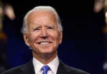 Biden says US roaring back to post-pandemic life, but COVID-19 yet to be "vanquished."
