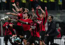 Milan beat Genoa to maintain Serie A lead