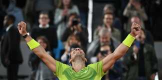Nadal celebrates after beating Djokovic
