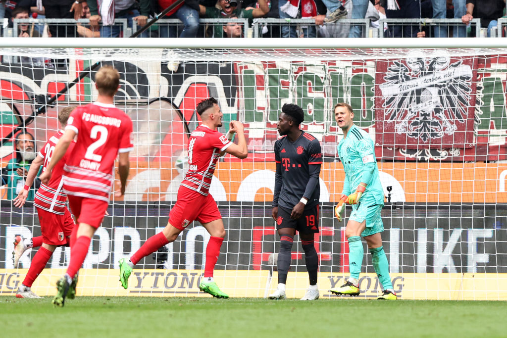Bundesliga: Bayern slump to defeat against Augsburg, Dortmund goes top