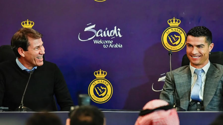 Rudi Garcia sitting with Ronaldo at his Al Nassr press conference