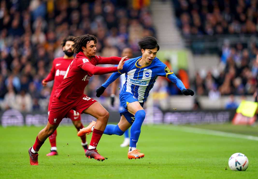 Brighton and Liverpool fight for the ball in the FA Cup