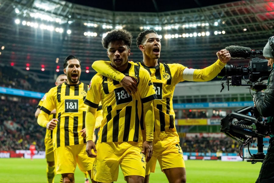 Dortmund players celebrate after scoring against Bayer Leverkusen