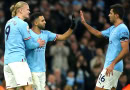 Man City players celebrate scoring against Aston Villa