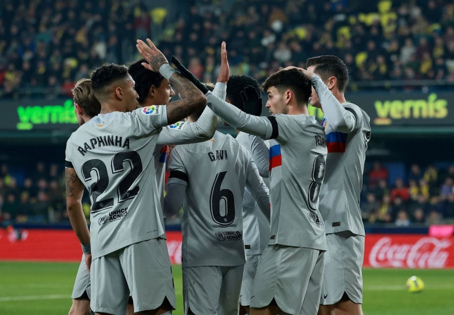 Barcelona celebrate scoring against Villarreal