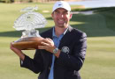 Scottie Scheffler poses with Phoenix Open trophy