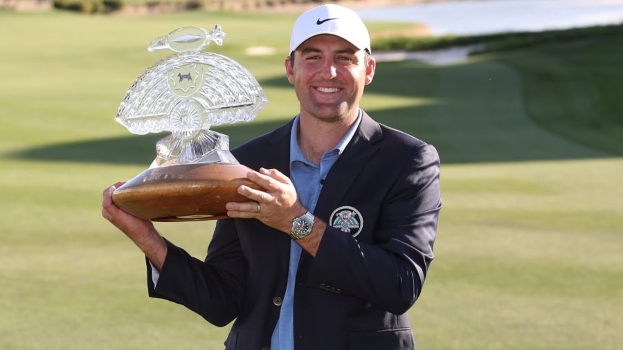 Scottie Scheffler poses with Phoenix Open trophy