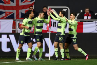 Manchester City celebrate scoring against Bristol