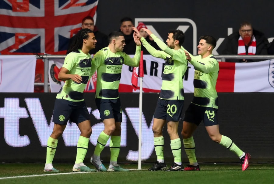 Manchester City celebrate scoring against Bristol