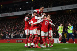 Arsenal celebrate scoring against Everton