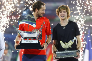 Daniil Medvedev and Andrey Rublev with their Dubai Open titles