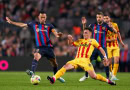 Barcelona and Girona players battling for the ball