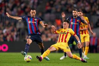 Barcelona and Girona players battling for the ball