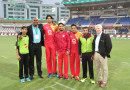 Ian Bishop poses with players during PSL game