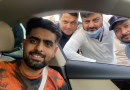 Babar Azam takes a picture with members of Excise departments