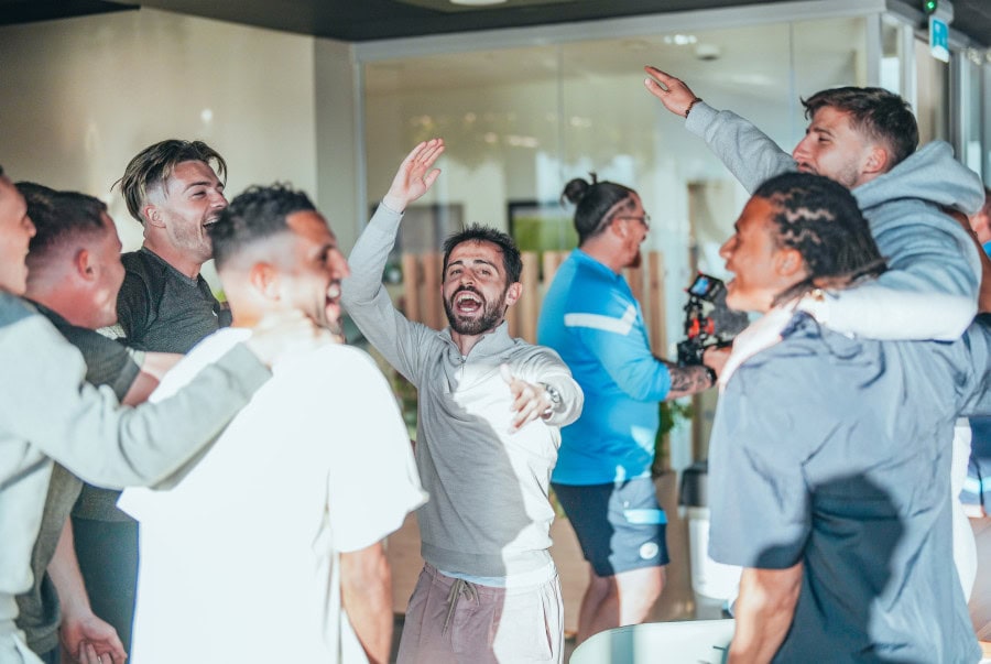 Manchester City players celebrate winning their third straight premier league title