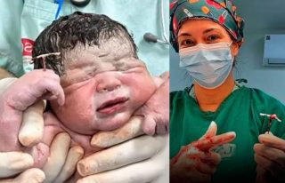 Unstoppable Baby Born Holding Moms Contraceptive Device In Hand