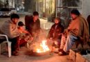 Citizens keeping their hands, bodies warm near fire amid freezing weather in Lahore