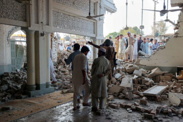 People Gather At A Damaged Mosque Following A Suicide Attack At A Police Facility In Kohat